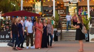 a group of people paying attention to a tourist guide